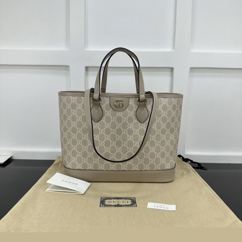 G*u*i shopping bags